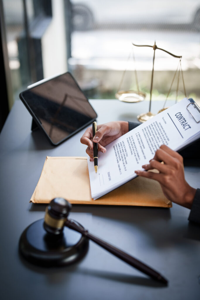Lawyer working at office. Asian Lawyer doing with contract or document in office. Law, legal